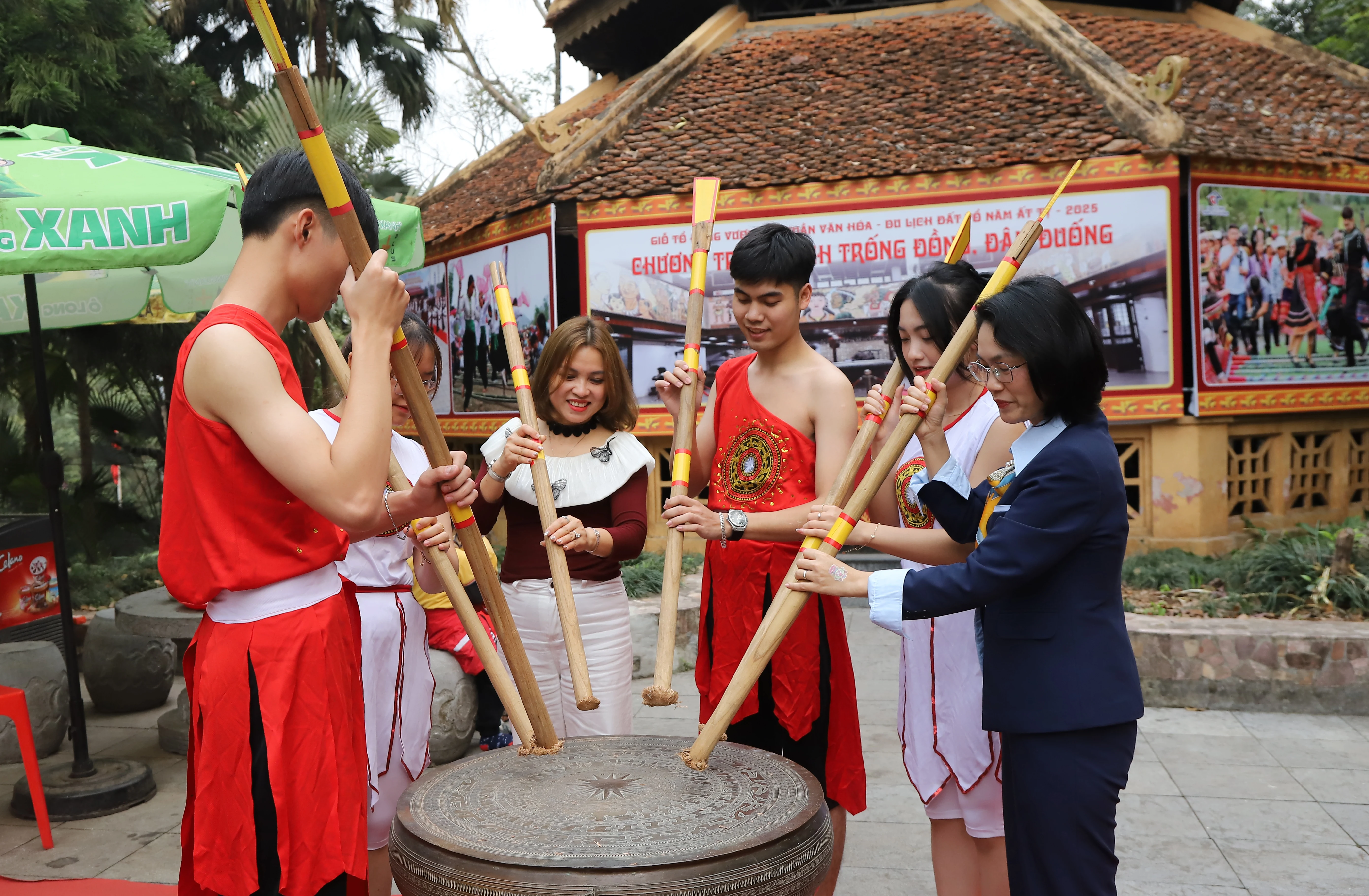 Bronze drum beating and bamboo pole stabbing performances for Hung Kings Commemoration Day